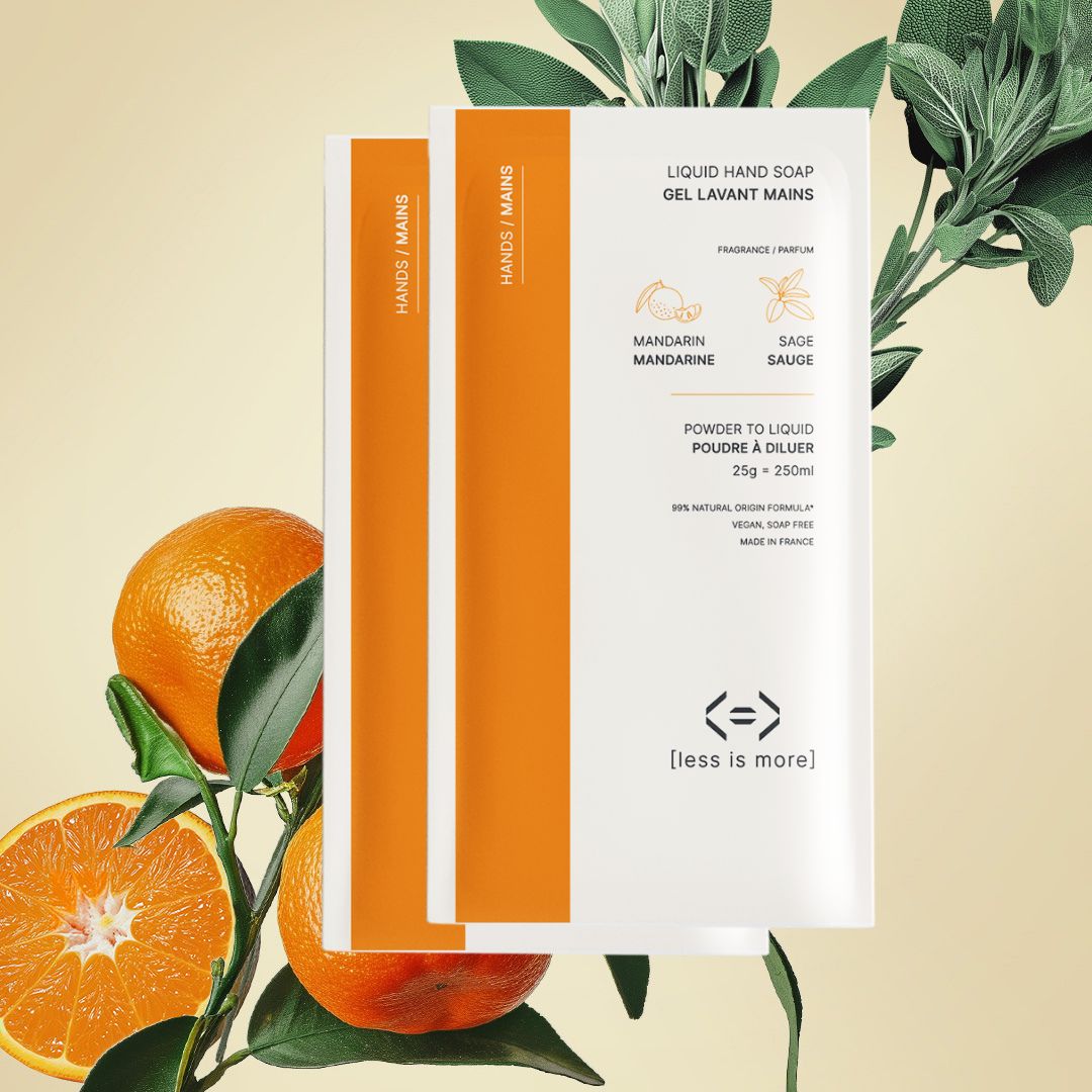 Liquid hand soap packaging with mandarin oranges and leaves on a beige background